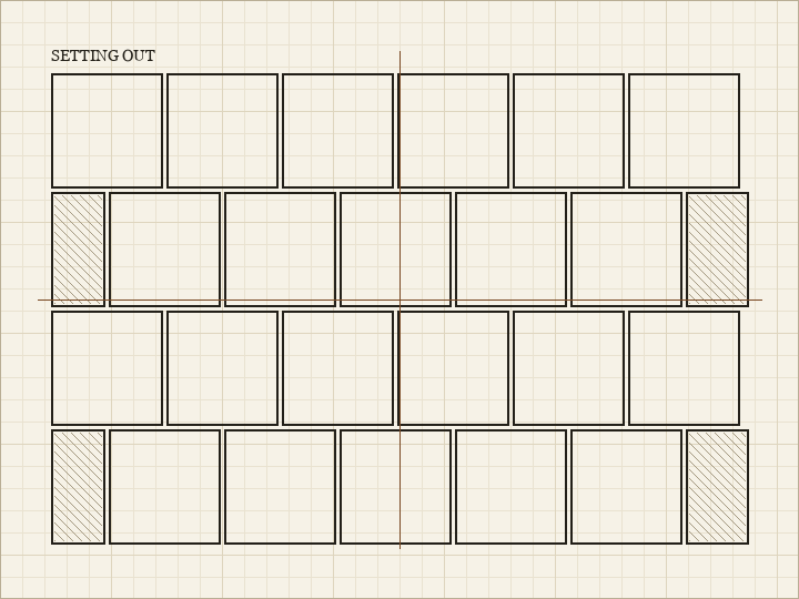 Grid diagram of a tiled surface with two centre lines marked and hatched cut tiles at the edges